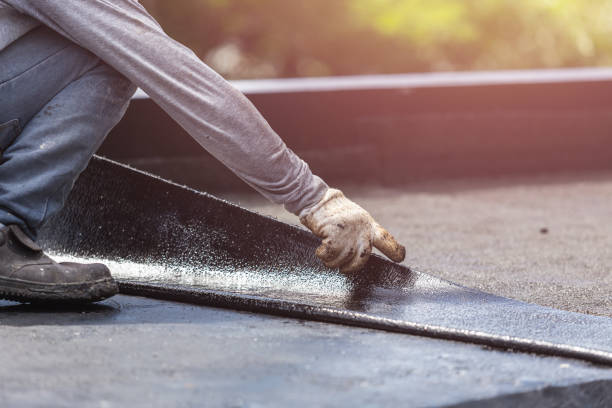 Professional Exterior Waterproofing technician working in Fishers, NY